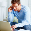 Modern guy working on laptop from home